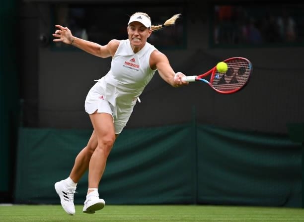 Angelique Kerber of Germany stretches to play a forehand in her Ladies' Singles First Round match against Nina Stojanovic of Serbia during Day Two of...