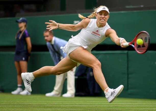Angelique Kerber of Germany stretches to play a forehand in her Ladies' Singles First Round match against Nina Stojanovic of Serbia during Day Two of...