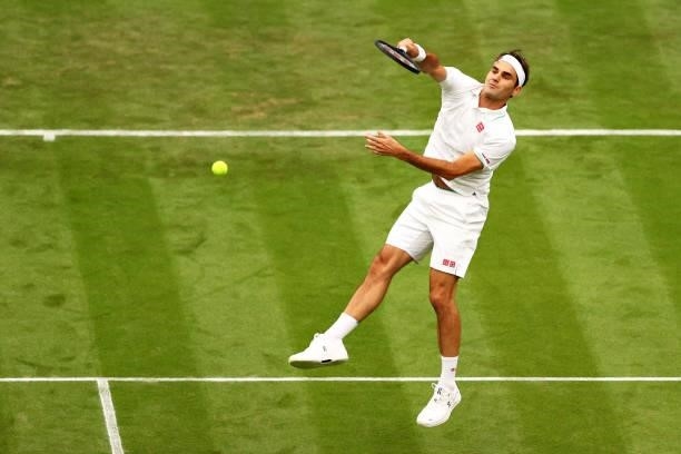 Roger Federer of Switzerland plays a forehand volley in his Men's Singles First Round match against Adrian Mannarino of France during Day Two of The...