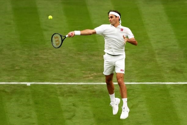 Roger Federer of Switzerland plays a forehand in his Men's Singles First Round match against Adrian Mannarino of France during Day Two of The...