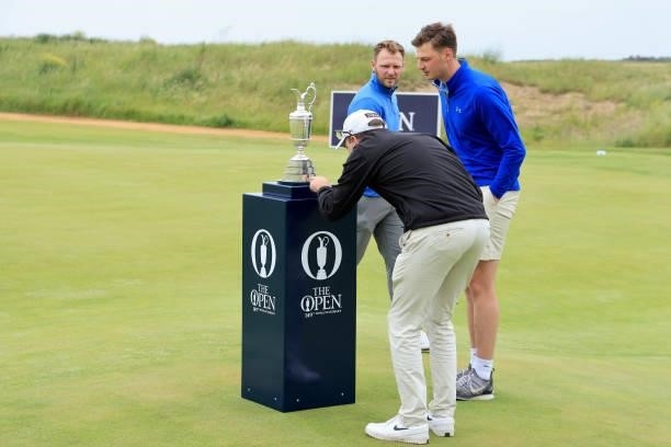 Sam Forgan of England walks past the Claret Jug before his first round during Final Qualifying for the 149th Open at Prince's Golf Club on June 29,...
