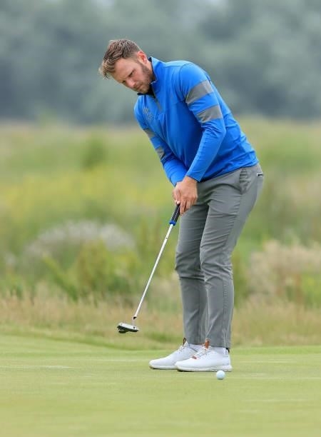 Sam Forgan of England putts on the first hole in his first round during Final Qualifying for the 149th Open at Prince's Golf Club on June 29, 2021 in...