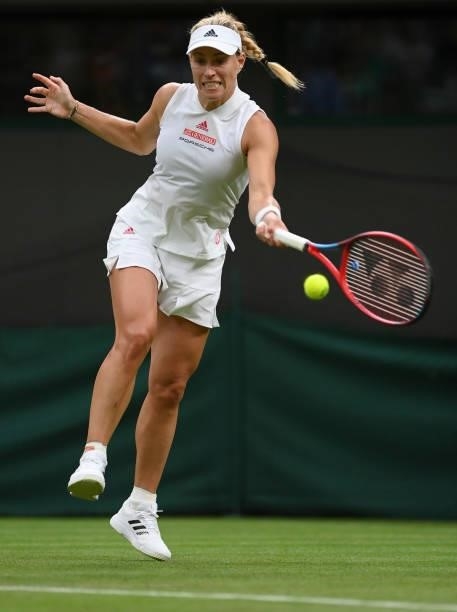 Angelique Kerber of Germany plays a forehand in her Ladies' Singles First Round match against Nina Stojanovic of Serbia during Day Two of The...