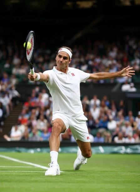 Roger Federer of Switzerland stretches to play a backhand in his Men's Singles First Round match against Adrian Mannarino of France during Day Two of...