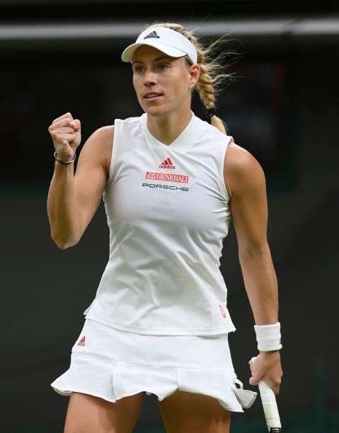 Angelique Kerber of Germany celebrates match point in her Ladies' Singles First Round match against Nina Stojanovic of Serbia during Day Two of The...