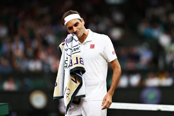 Roger Federer of Switzerland reacts in his Men's Singles First Round match against Adrian Mannarino of France during Day Two of The Championships -...
