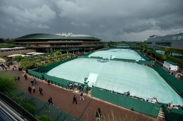 General View of the rain covers on the outside courts during Day Two of The Championships - Wimbledon 2021 at All England Lawn Tennis and Croquet...