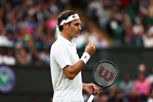 Roger Federer of Switzerland reacts in his Men's Singles First Round match against Adrian Mannarino of France during Day Two of The Championships -...