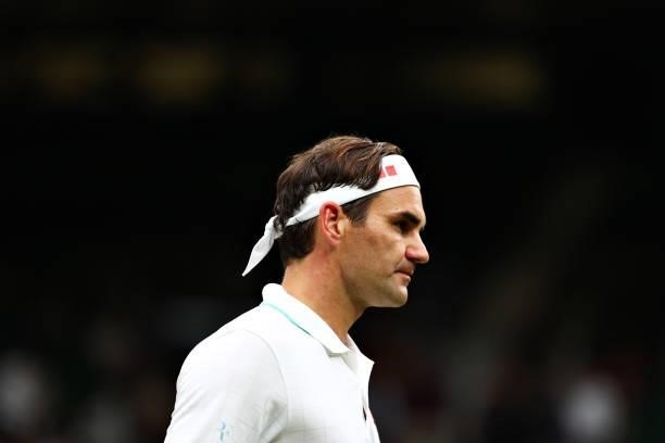 Roger Federer of Switzerland looks on in his Men's Singles First Round match against Adrian Mannarino of France during Day Two of The Championships -...