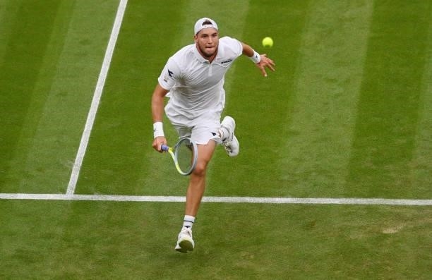 Jan-Lennard Struff of Germany runs to play a forehand in his Men's Singles First Round match against Daniil Medvedev of Russia during Day Two of The...