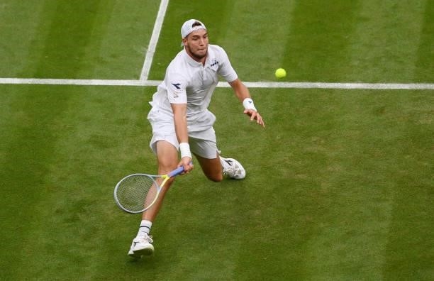 Jan-Lennard Struff of Germany stretches to play a forehand in his Men's Singles First Round match against Daniil Medvedev of Russia during Day Two of...