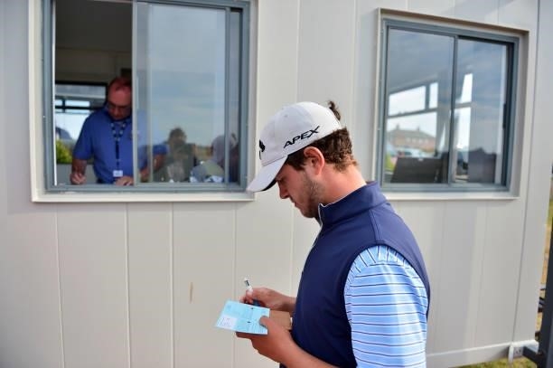 Sam Bairstow of England hand in his score card during Final Qualifying for the 149th Open at St Annes Old Links Golf Club on June 29, 2021 in Lytham...