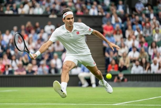 Roger Federer of Switzerland plays a forehand in his Men's Singles First Round match against Adrian Mannarino of France during Day Two of The...