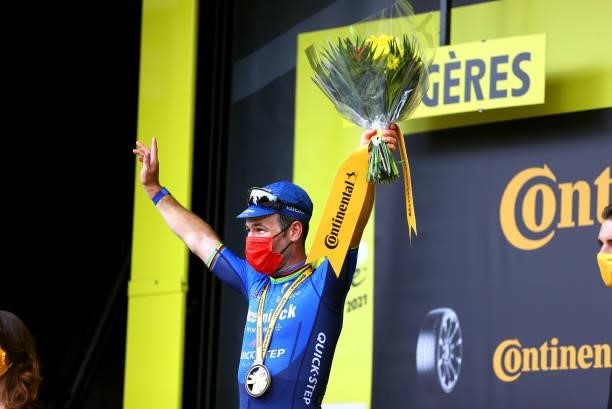 Mark Cavendish of The United Kingdom and Team Deceuninck - Quick-Step celebrates at podium during the 108th Tour de France 2021, Stage 4 a 150,4km...