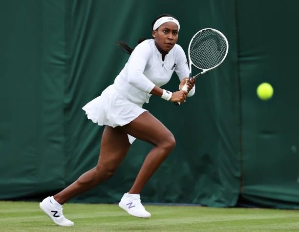Coco Gauff of The United States runs to play a backhand in her Ladies' Singles First Round match against Francesca Jones of Great Britain during Day...
