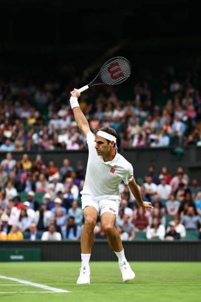 Roger Federer of Switzerland plays a backhand in his Men's Singles First Round match against Adrian Mannarino of France during Day Two of The...