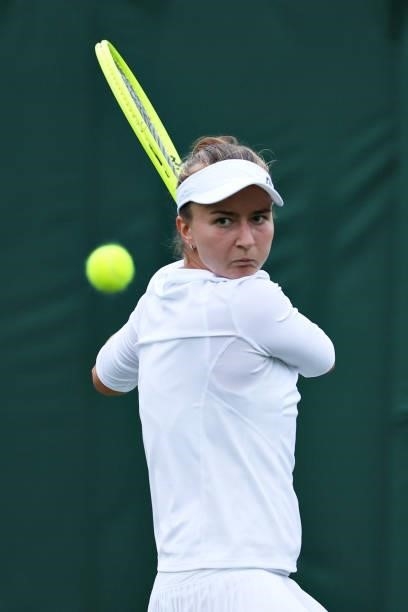 Barbora Krejcikova of The Czech Republic plays a backhand in her Ladies' Singles First Round match against Clara Tauson of Denmark during Day Two of...