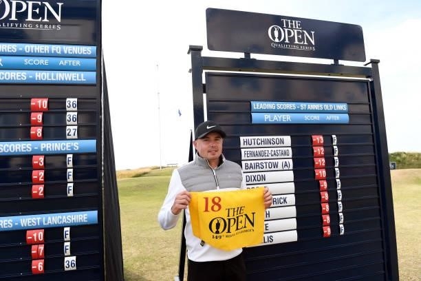 Ben Hutchinson of England poses with The Open flag after qualifying for the 149th Open Championship during Final Qualifying for the 149th Open at St...