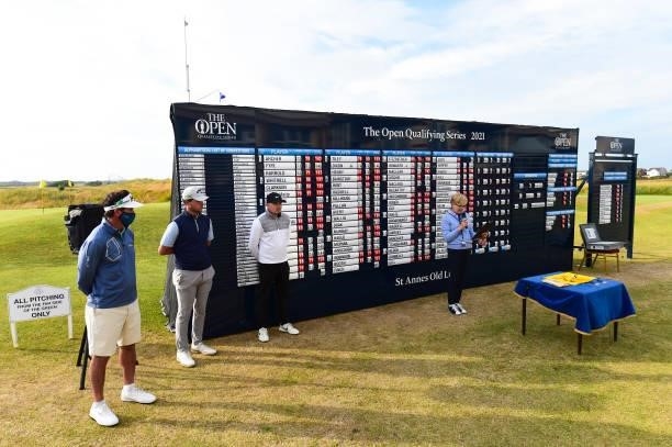 Gonzalo Fernández-Castaño of Spain, Ben Hutchinson of England and Sam Bairstow of England poses with The Open flag after qualifying for the 149th...
