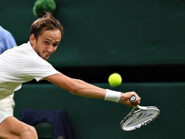 Daniil Medvedev of Russia stretches to play a backhand in his Men's Singles First Round match against Jan-Lennard Struff of Germany during Day Two of...