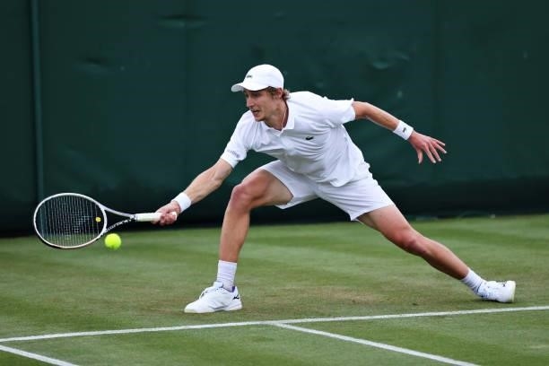 Marc Polmans of Australia plays a forehand in his Men's Singles First Round match against Yen-hsun Lu of Taiwan during Day Two of The Championships -...