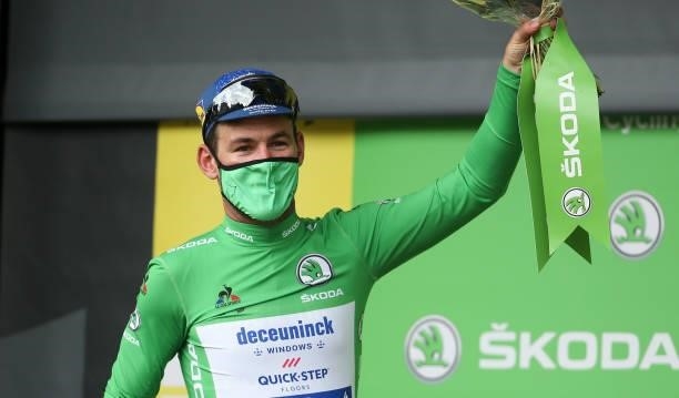 Mark Cavendish of Great Britain and Deceuninck - Quick Step wears the green jersey of best sprinter during the podium ceremony after winning stage 4...