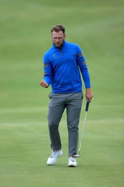 Sam Forgan of England celebrates holing a putt on his final hole in his second round to secure a place in the 149th Open Championship during Final...