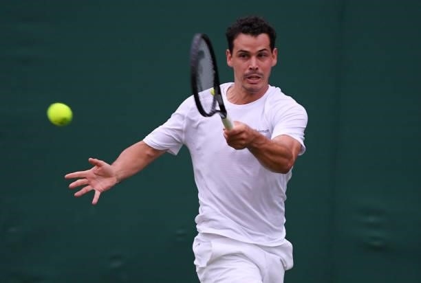 Alex Bolt of Australia plays a forehand in his Men's Singles First Round match against Filip Krajinovic of Serbia during Day Two of The Championships...
