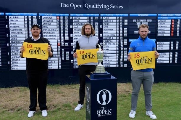 The three qualifiers Deyen Lawson of Australia, Connor Worsdall of England and Sam Forgan of England pose beside the Claret Jug in front of the main...