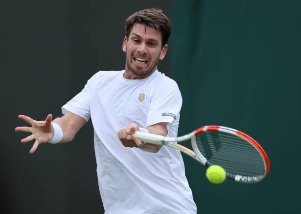 Cameron Norrie of Great Britain plays a forehand in his Men's Singles First Round match against Lucas Pouille of France during Day Two of The...
