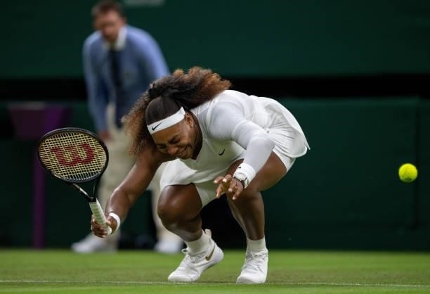 Serena Williams of The United States reacts as she winces in pain in her Ladies' Singles First Round match against Aliaksandra Sasnovich of Belarus...