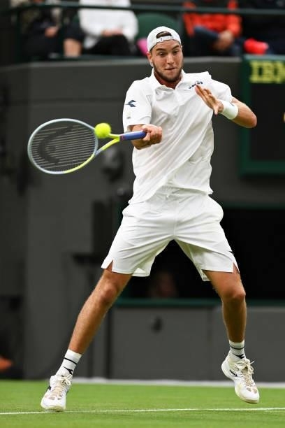 Jan-Lennard Struff of Germany plays a forehand in his Men's Singles First Round match against Daniil Medvedev of Russia during Day Two of The...