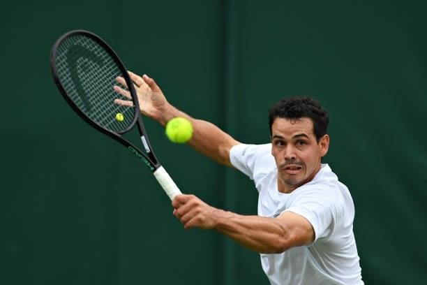 Alex Bolt of Australia plays a backhand in his Men's Singles First Round match against Filip Krajinovic of Serbia during Day Two of The Championships...