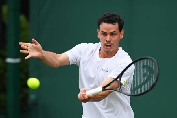 Alex Bolt of Australia plays a forehand in his Men's Singles First Round match against Filip Krajinovic of Serbia during Day Two of The Championships...