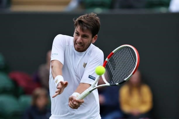 Cameron Norrie of Great Britain plays a forehand in his Men's Singles First Round match against Lucas Pouille of France during Day Two of The...
