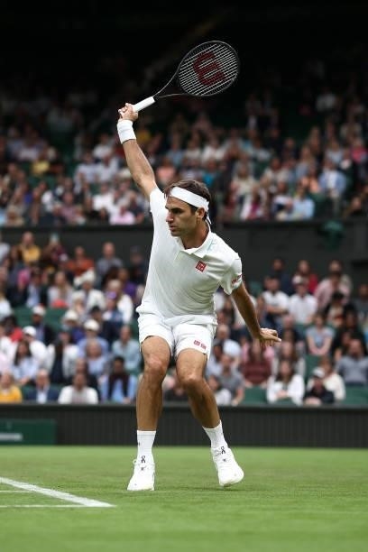 Roger Federer of Switzerland plays a backhand in his Men's Singles First Round match against Adrian Mannarino of France during Day Two of The...