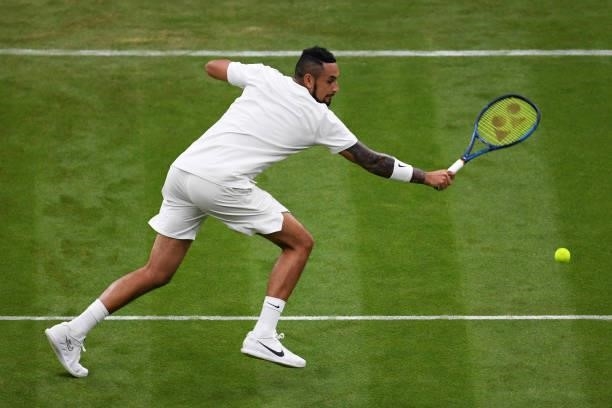 Nick Kyrgios of Australia plays a backhand in his Men's Singles First Round match against Ugo Humbert of France during Day Two of The Championships -...