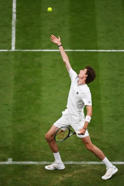 Ugo Humbert of France serves in his Men's Singles First Round match against Nick Kyrgios of Australia during Day Two of The Championships - Wimbledon...