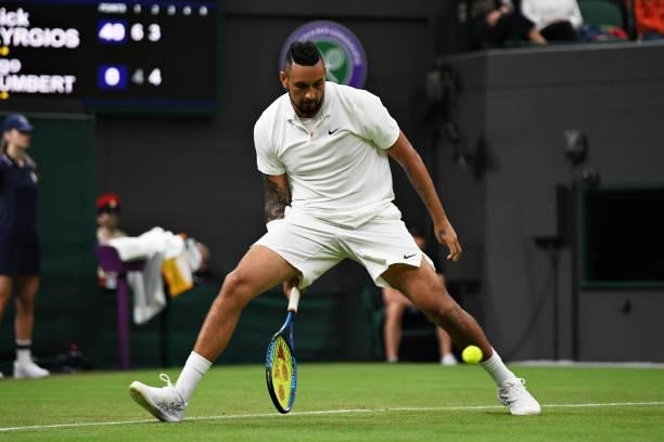 Nick Kyrgios of Australia plays a shot through his legs in his Men's Singles First Round match against Ugo Humbert of France during Day Two of The...