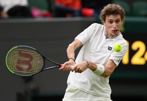 Ugo Humbert of France plays a backhand in his Men's Singles First Round match against Nick Kyrgios of Australia during Day Two of The Championships -...