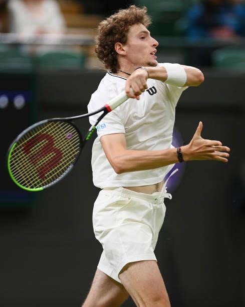 Ugo Humbert of France plays a forehand in his Men's Singles First Round match against Nick Kyrgios of Australia during Day Two of The Championships -...