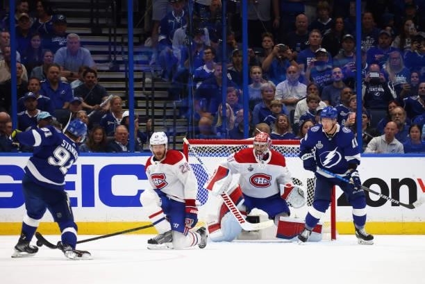 Jon Merrill and Carey Price of the Montreal Canadiens defend against Steven Stamkos of the Tampa Bay Lightning during Game One of the 2021 NHL...