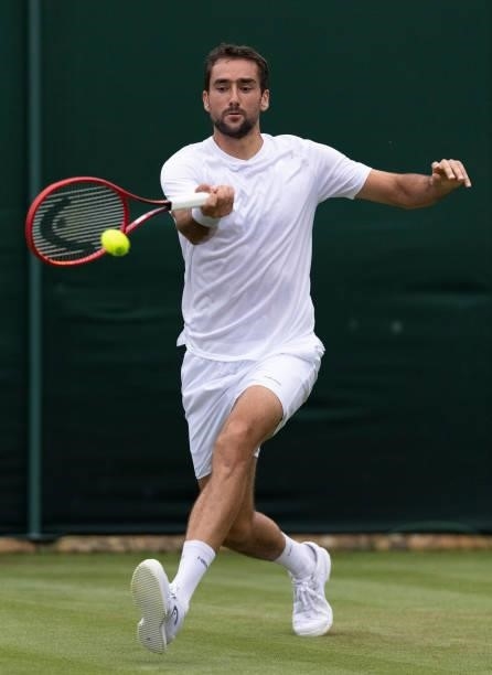 Marin Cilic of Croatia plays a forehand in his Men's Singles First Round match against Salvatore Caruso of Italy during Day Two of The Championships...