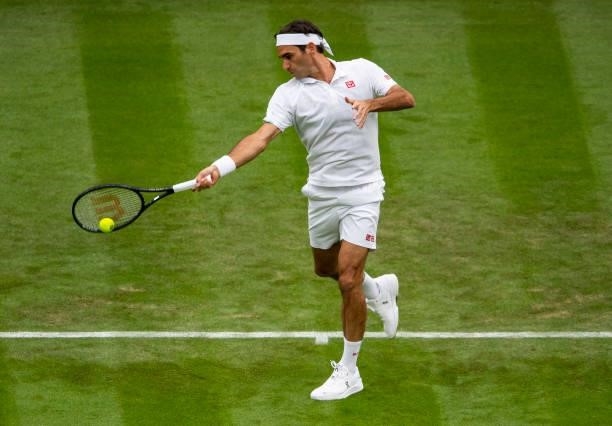 Roger Federer of Switzerland hits a forehand against Adrian Mannarino of France in the first round of the gentleman's singles, during Day Two of The...