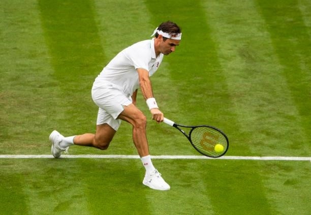 Roger Federer of Switzerland hits a backhand against Adrian Mannarino of France in the first round of the gentleman's singles, during Day Two of The...