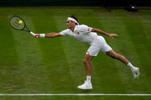 Roger Federer of Switzerland hits a forehand against Adrian Mannarino of France in the first round of the gentleman's singles, during Day Two of The...