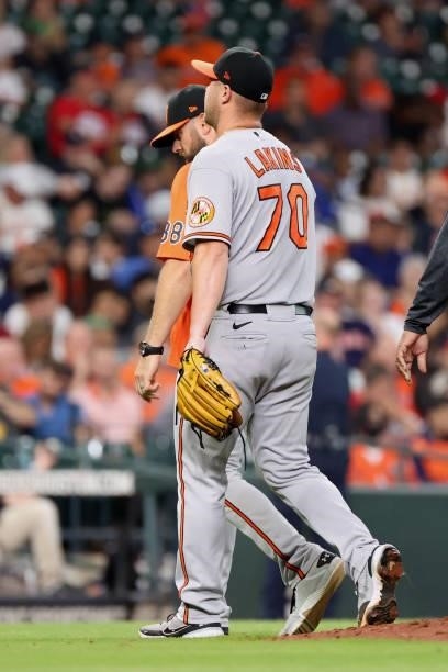 Travis Lakins Sr. #70 of the Baltimore Orioles exits the game during the second inning against the Houston Astros at Minute Maid Park on June 29,...
