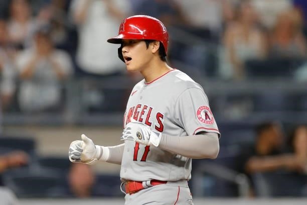 Shohei Ohtani of the Los Angeles Angels reacts after hitting a two-run home run during the fifth inning against the New York Yankees at Yankee...
