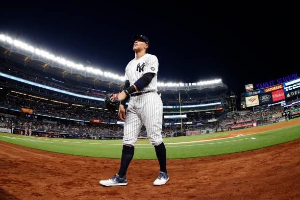 Aaron Judge of the New York Yankees smiles as he heads to the dugout during the fifth inning against the Los Angeles Angels at Yankee Stadium on June...