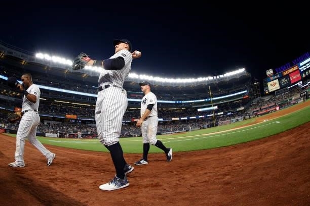 Aaron Judge of the New York Yankees throws a ball to a fan during the fifth inning against the Los Angeles Angels at Yankee Stadium on June 29, 2021...